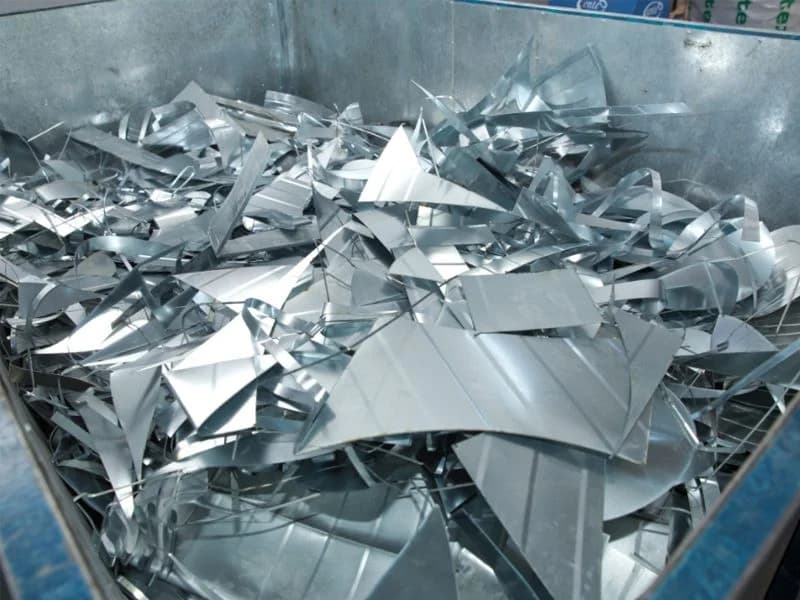 Aluminum offcuts in a recycling bin