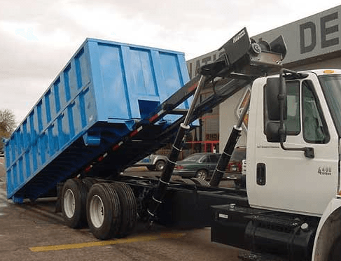 Zikloa roll-off truck loading an industrial waste container